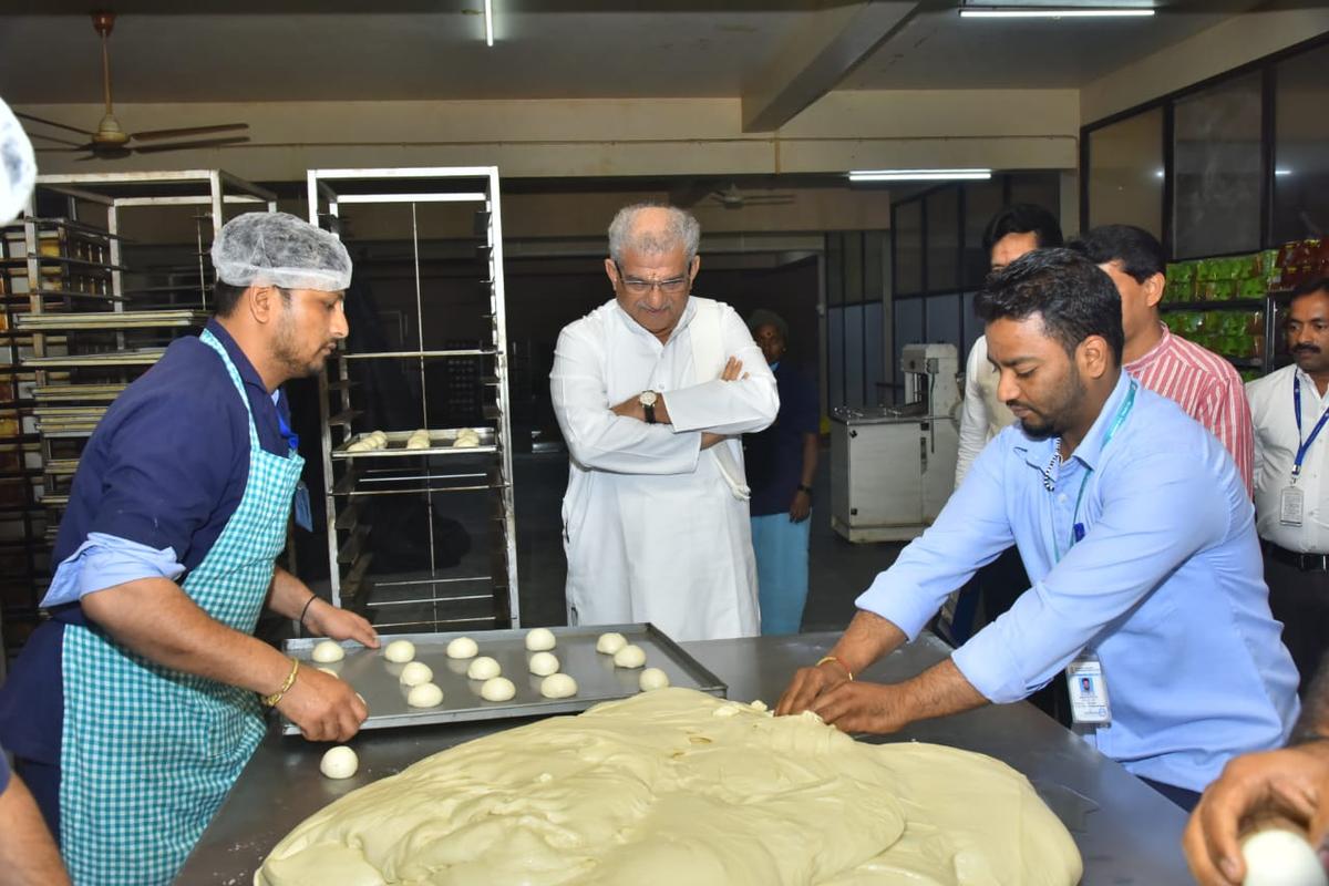 D. Veerendra Heggade (centre), administrator of the Sri Dharmasthala Manjunatha Swamy temple in Dharmasthala, chose a holistic approach. His team researched millets and farmers who grow the crop. Based on the findings, their first step was to set up a processing unit in Dharwad, in north Karnataka.