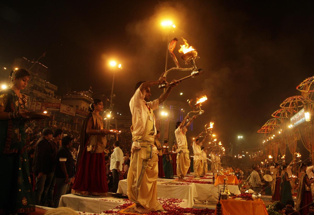 Prayers being performed on the banks of the Ganga on the occasion of Dev Deepavali at Dashashwamedh Ghat in Varanasi. 