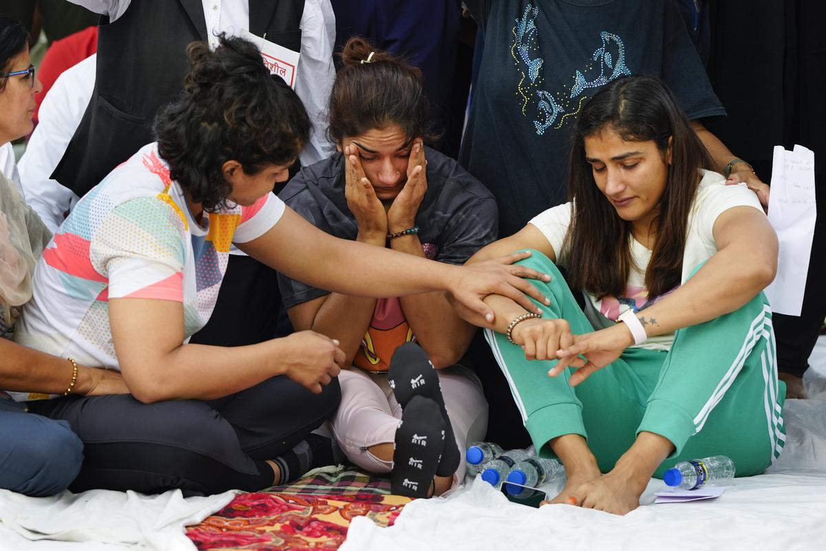 New Delhi: Wrestlers Vinesh Phogat (centre), Sangita Phogat (right) and Sakshi Malik during their protest at Jantar Mantar, in New Delhi, Wednesday, April 26, 2023