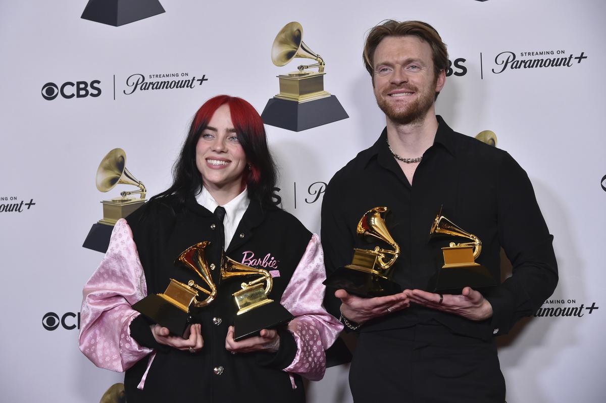 Billie Eilish, left, and Finneas pose in the press room with the awards for best song written for visual media and song of the year for “What Was I Made For?” from “Barbie the Album” during the 66th annual Grammy Awards on Sunday, Feb. 4, 2024, in Los Angeles.