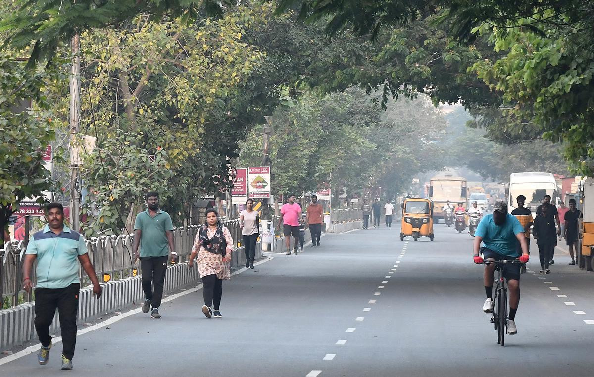 Cyclists and walkers at the early morning at Ashok Nagar.