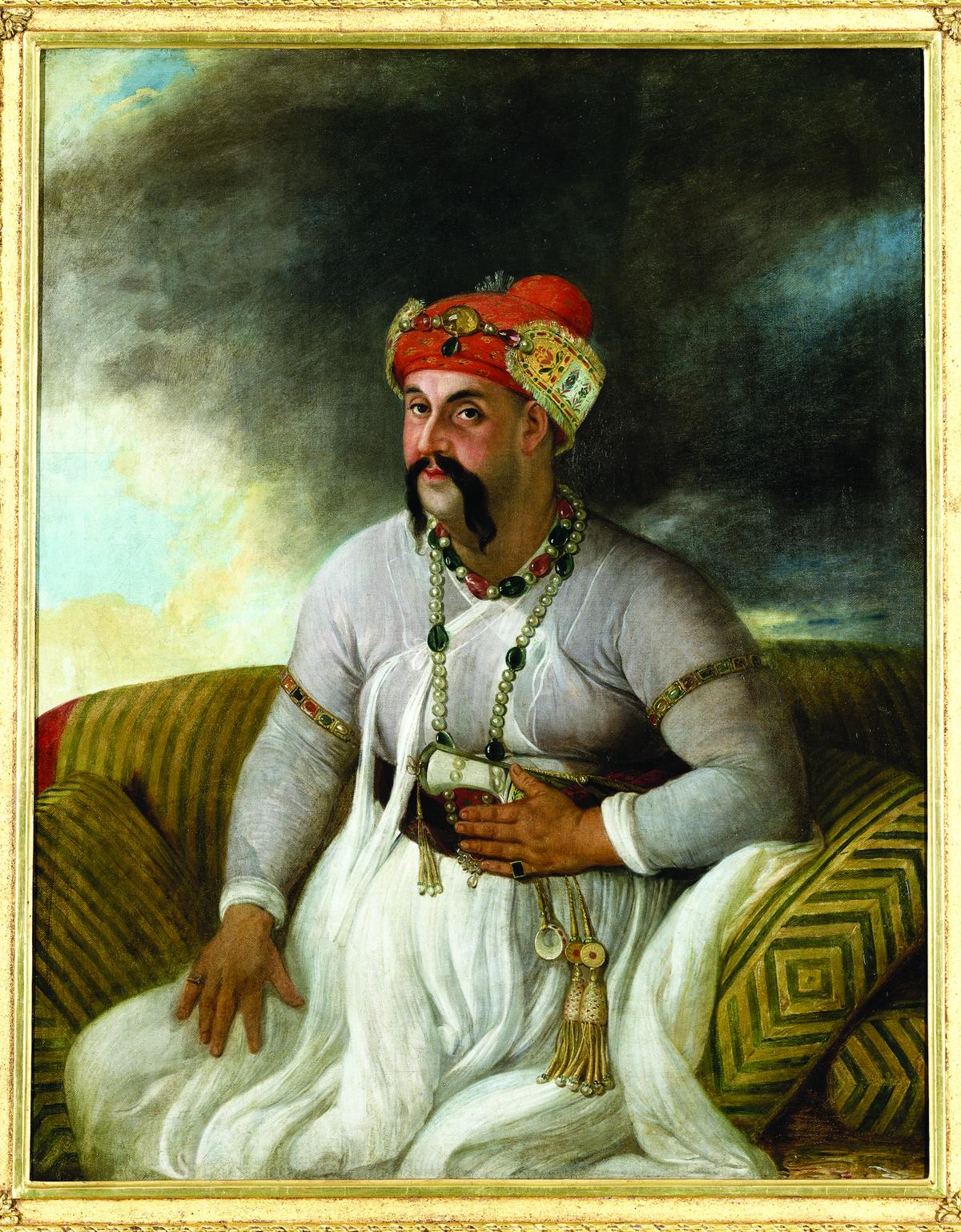 An oil painting of Asaf ud Daula in a white muslin dress, with necklaces and armlets of pearls, rubies and uncut emeralds. He wears the typical Lucknow headdress of a red turban ornamented with a tinsel and velvet appliqué band attached by a jewelled frontlet. An oil painting of Asaf ud Daula in a white muslin dress, with necklaces and armlets of pearls, rubies and uncut emeralds. He wears the typical Lucknow headdress of a red turban ornamented with a tinsel and velvet appliqué band attached by a jewelled frontlet.