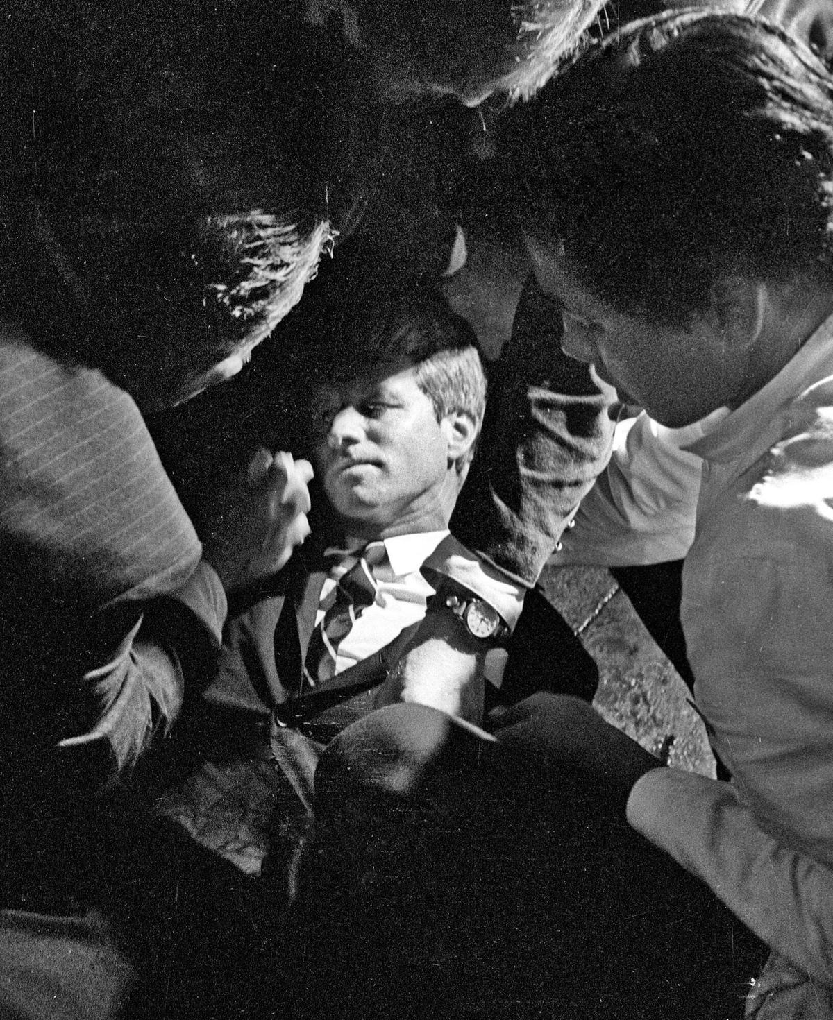  In this June 5, 1968 file photo, Hotel busboy Juan Romero, right, comes to the aid of Senator Robert F. Kennedy, as he lies on the floor of the Ambassador hotel in Los Angeles moments after he was shot. Romero was a teenage busboy in June 1968 when Kennedy walked through the Ambassador Hotel kitchen after his victory in the California presidential primary and an assassin shot him in the head. He held the mortally wounded Kennedy as he lay on the ground, struggling to keep the senator’s bleeding head from hitting the floor.