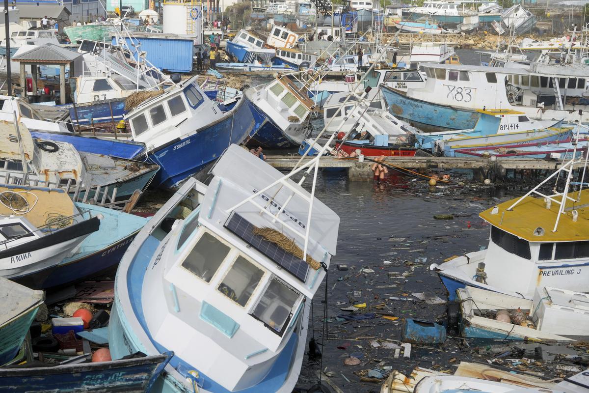 Fishing vessels damaged by Hurricane Beryl sit upended at the Bridgetown Fisheries in Barbados, on July 1, 2024