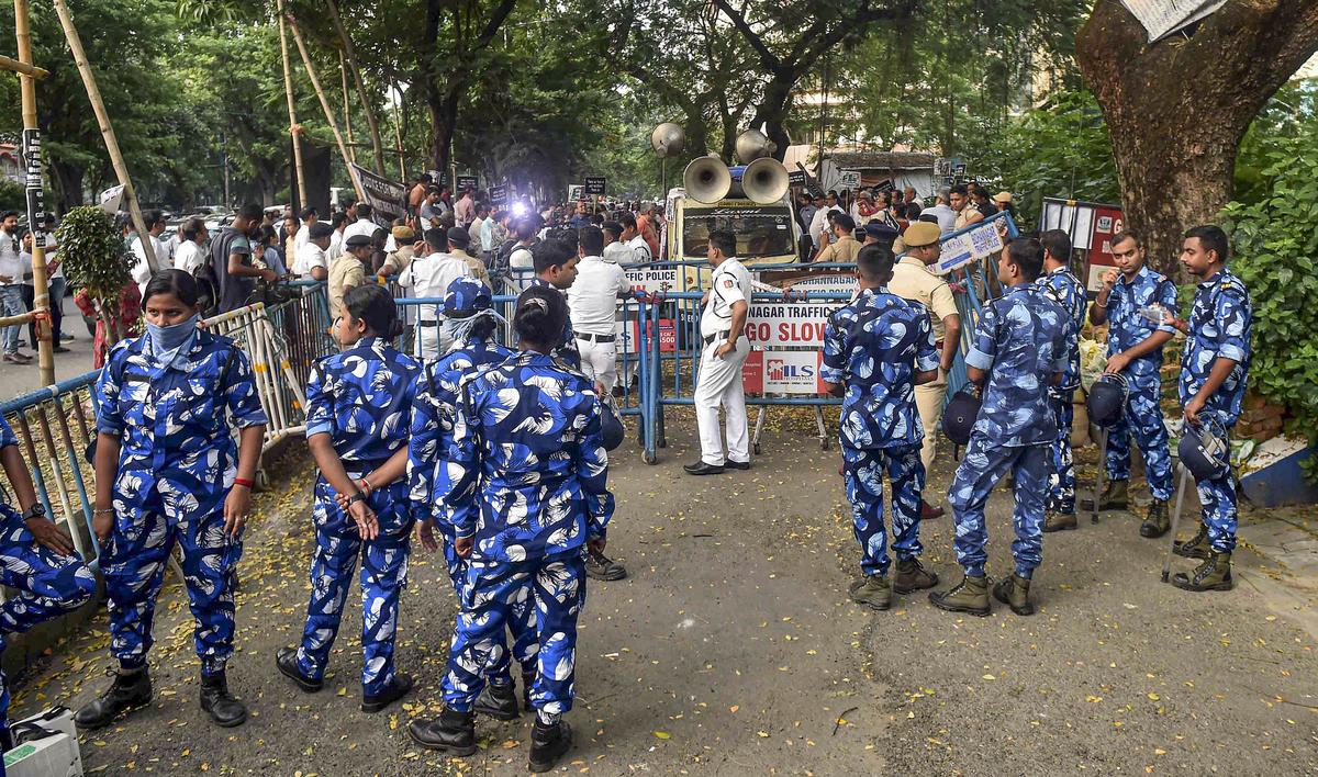 Security personnel stand guard in front of West Bengal Medical Council office during the doctors’ protest in Kolkata on September 19, 2024. Security personnel stand guard in front of West Bengal Medical Council office during the doctors’ protest in Kolkata on September 19, 2024.
