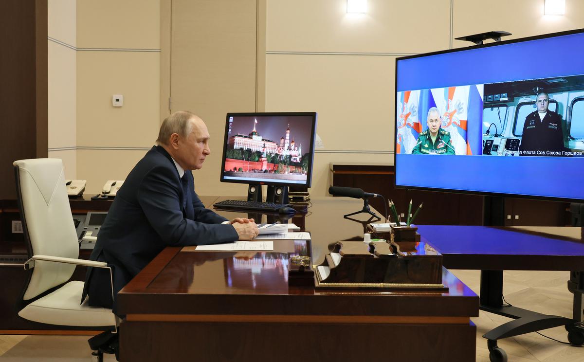 Russian President Vladimir Putin attends a video conference with Russian Defence Minister Sergei Shoigu, left, on a tv screen, and Igor Krokhmal, commander of the frigate named ‘Admiral of the Fleet of the Soviet Union Gorshkov’, in Moscow, Russia. ‘Russia is no longer going to be a military great power and it’ll take at least a decade to reconstitute Russia’s forces that have been destroyed over the past year,’ says Mark Galeotti.