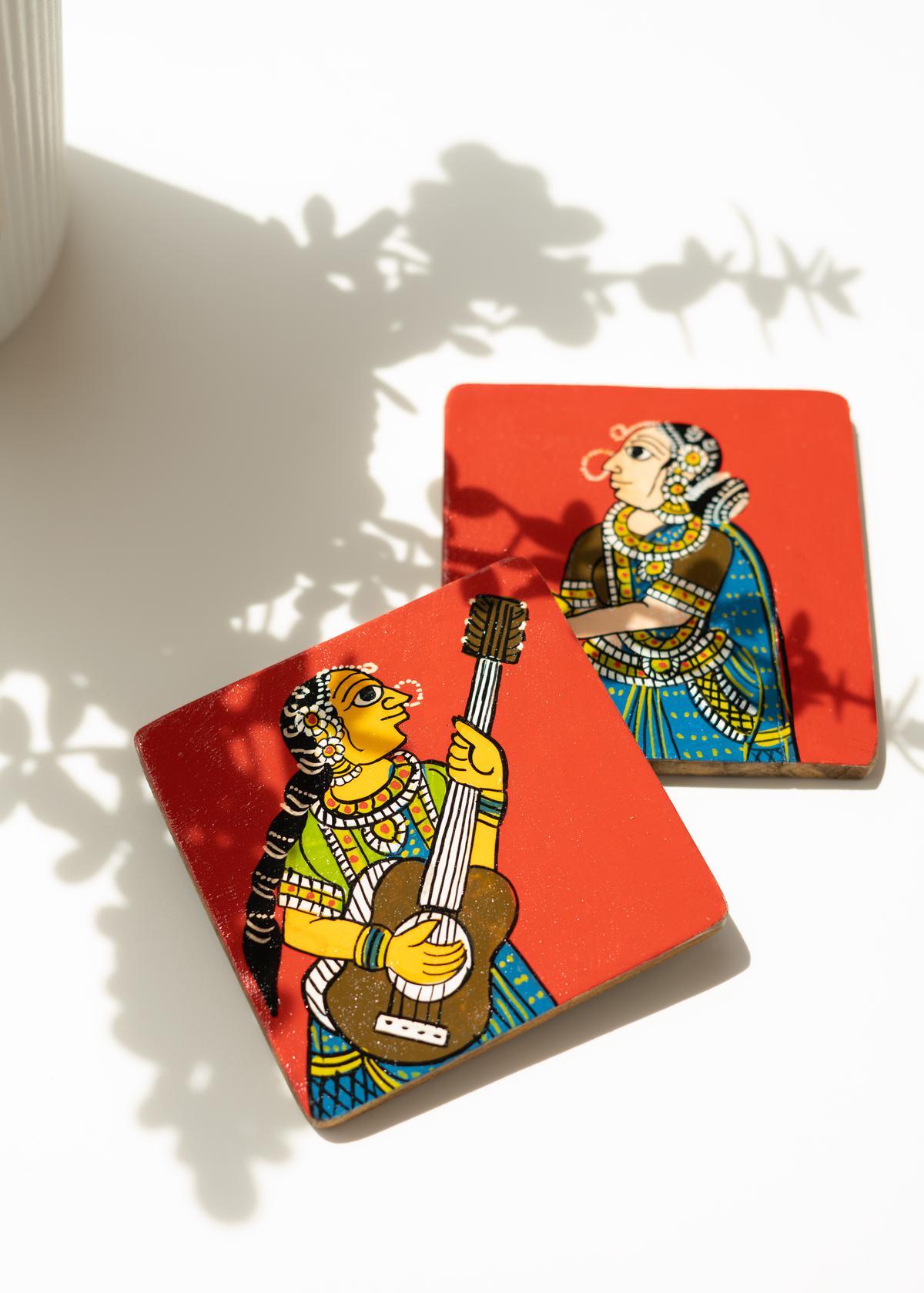Wooden coasters painted with Cheriyal art 