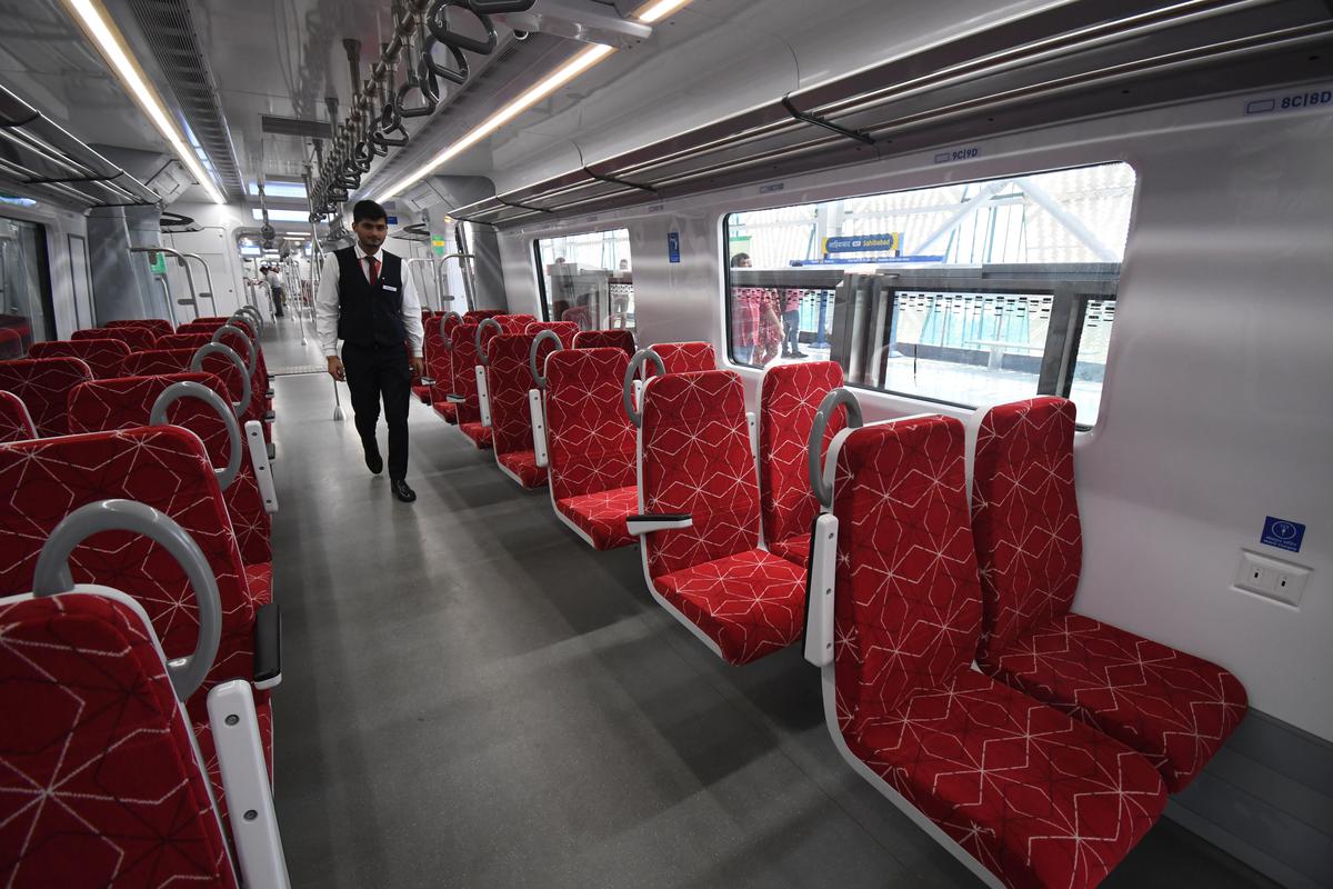 Each compartment has two rows of seats on either side of a spacious aisle, where passengers can stand and travel.