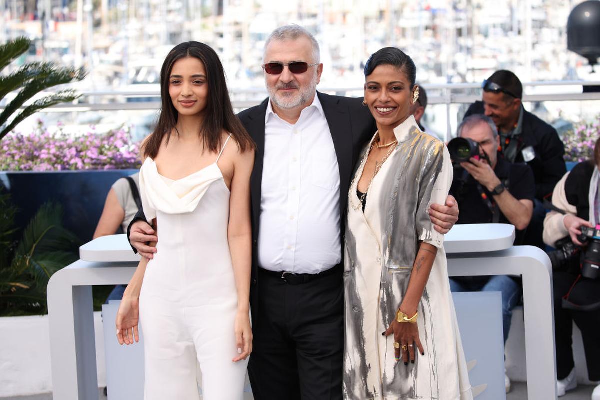 Actors Omara Shetty and Anasuya Sengupta with director Konstantin Bojanov (centre) during the photocall of their film 'The Shameless' at Cannes 2024.
