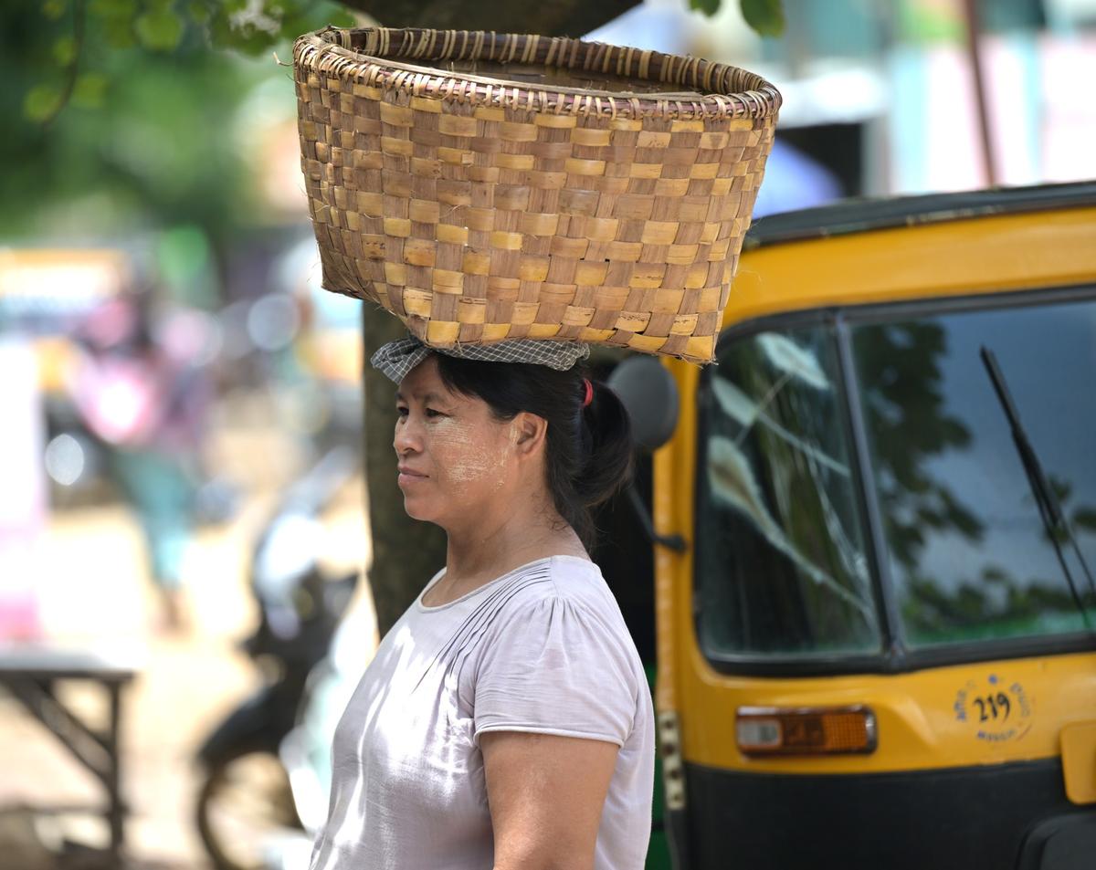 Drawn by the promise of education for their children, Myanmar women now walk the markets of Moreh, selling locally-grown goods as they carve out a life across the border. Drawn by the promise of education for their children, Myanmar women now walk the markets of Moreh, selling locally-grown goods as they carve out a life across the border.