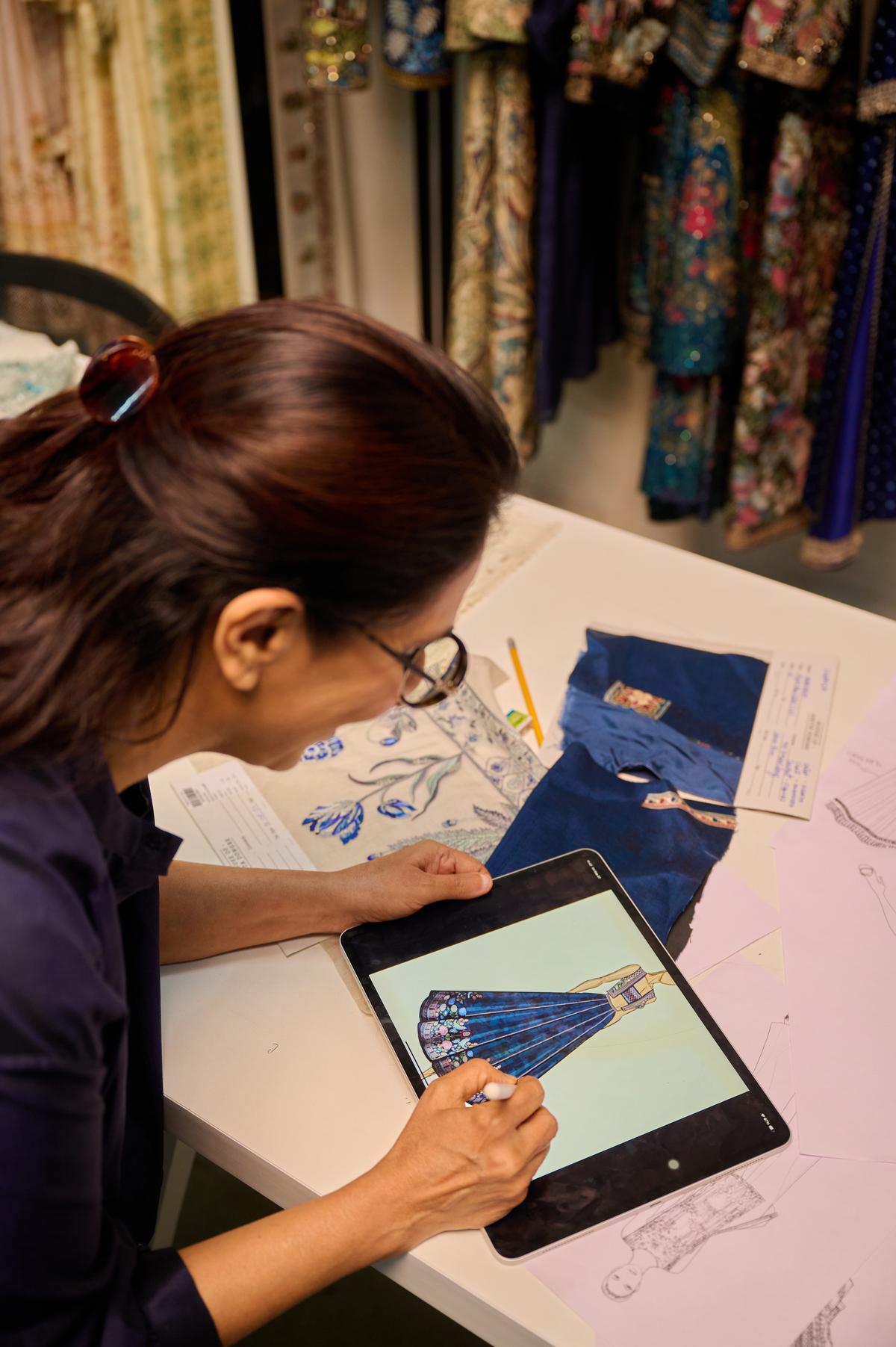 Anita Dongre working on the doll