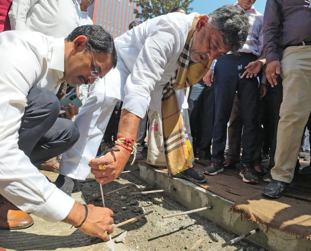 Deputy Chief Minister D K Shivakumar inspecting the white topping work during his city rounds