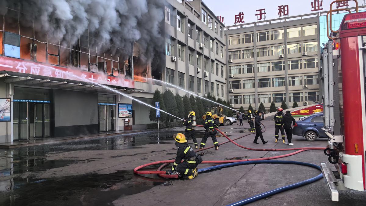 Fire at a coal mining company building in northern China kills 26 and injures dozens