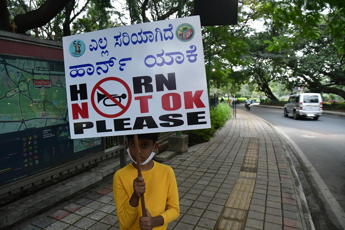 Citizens for Citizens (C4C) members hold placards with messages to No Honking / Silent Zone, for drastically reducing Vehicular Noise Pollution inside Sri Chamarajendra Park popularly known as Cubbon park.