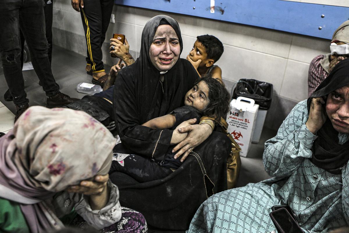 Wounded Palestinians at the Al-Shifa hospital in Gaza City, central Gaza Strip, after arriving from al-Ahli hospital following an explosion there, on Tuesday, October 17, 2023. 