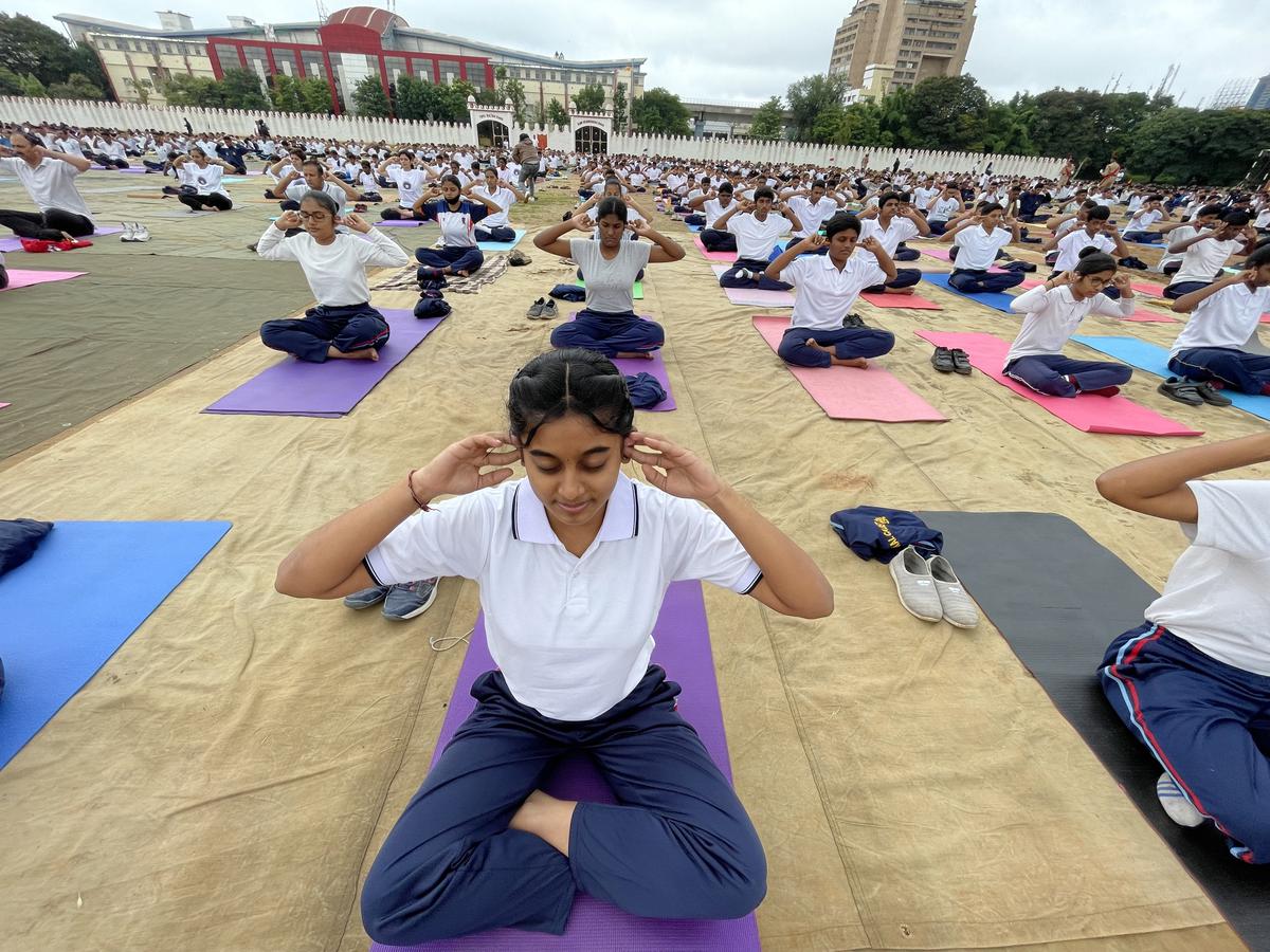 Participants take part in a mass yoga event to mark the International Day of Yoga at Manekshaw parade ground in Bengaluru on Tuesday, June 21, 2022. 
