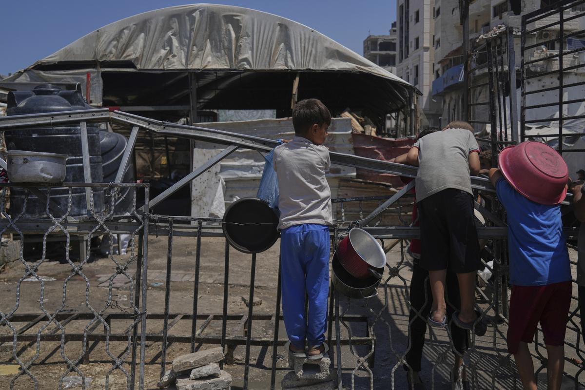 A Palestinian children wait at a community kitchen before donated food is prepared and distributed in Gaza City, on August 22, 2025. A Palestinian children wait at a community kitchen before donated food is prepared and distributed in Gaza City, on August 22, 2025.