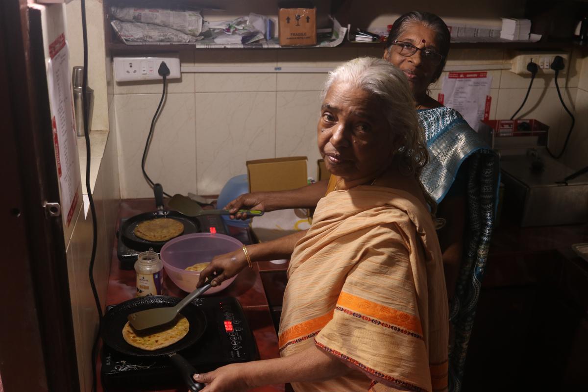 Vijaya KN and her help, Chandrika, cooking parathas