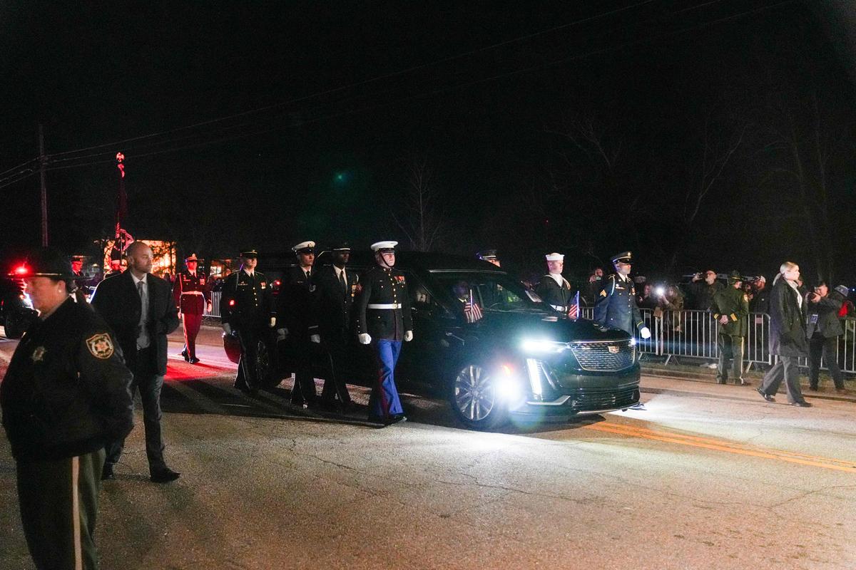 The funeral procession of former President Jimmy Carter passes by on January 9, 2025 in Plains, Georgia. 