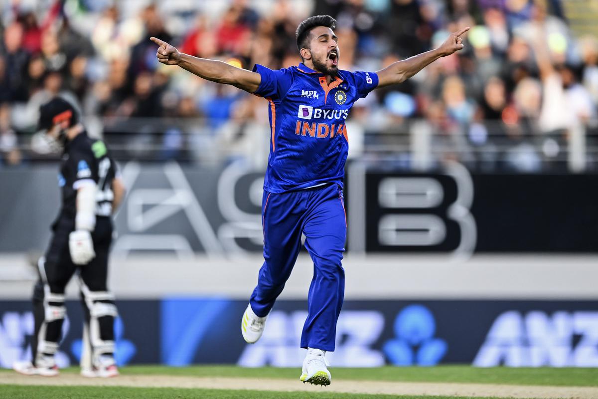 Umran Malik celebrates taking the wicket of Devon Conway during the first ODI between New Zealand and India in Auckland, New Zealand, on November 25, 2022. 