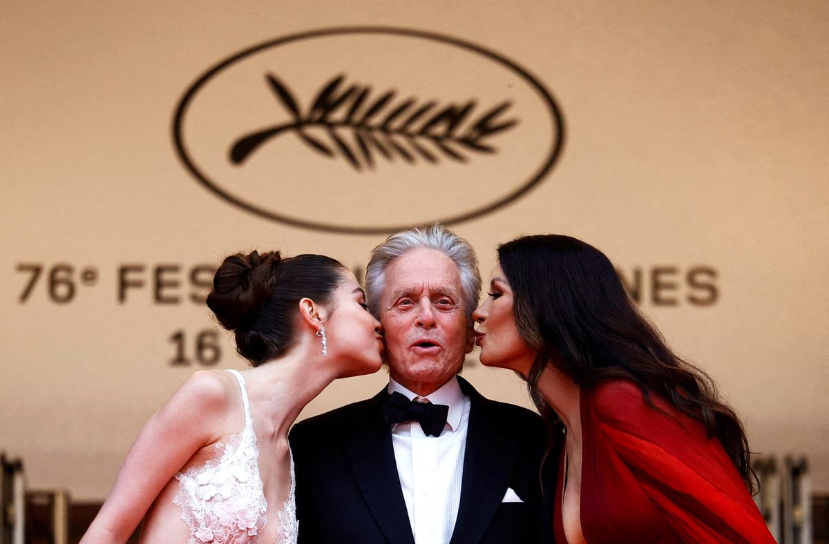 Michael Douglas, Catherine Zeta-Jones and their daughter Carrie posing