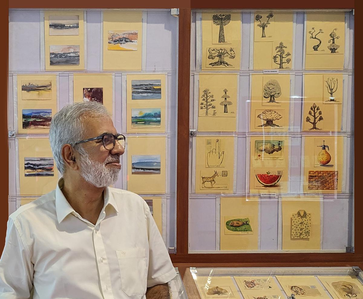 Giridhar Khasnis and some of the postcards on display at the second edition of Pincodes 