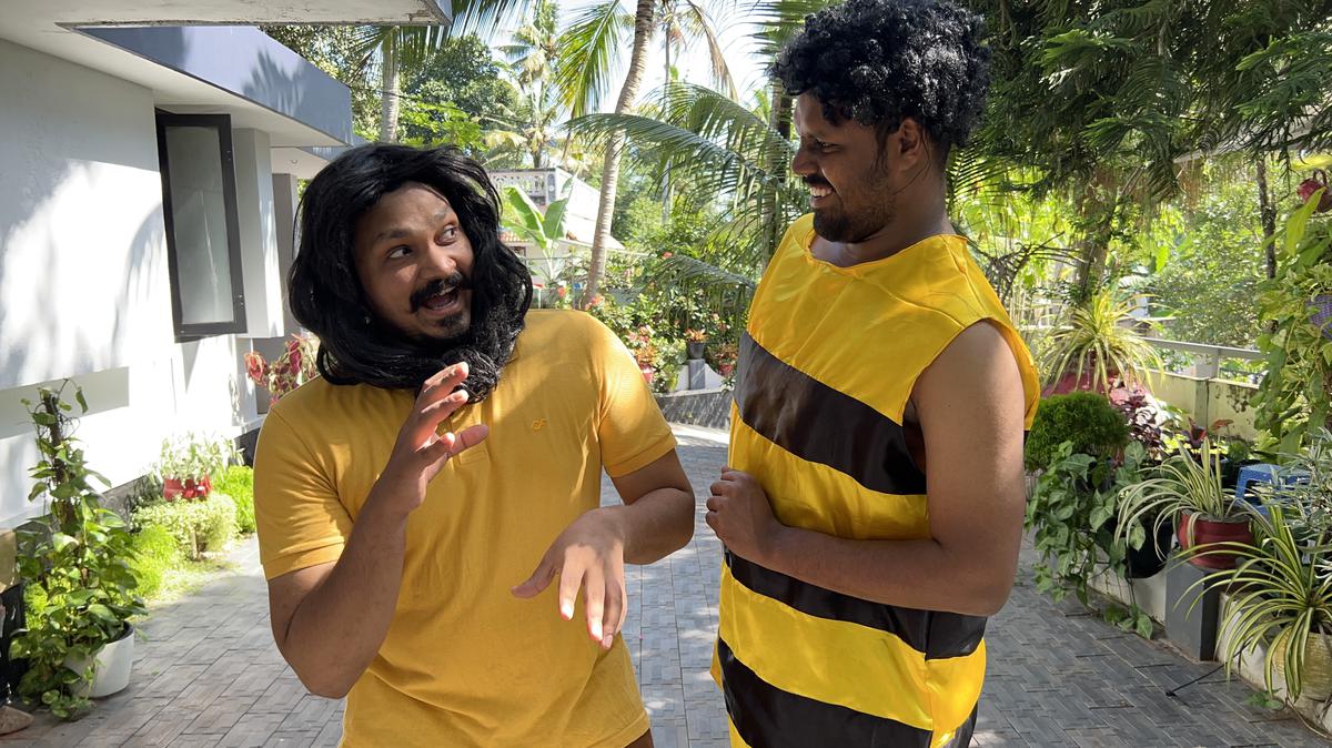 Jassim Hashim (left) dressed up as a lion and Shameer Khan (R) as a honey bee