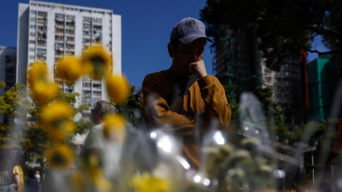 Hong Kong mourns victims of building fire that killed 128 and counting