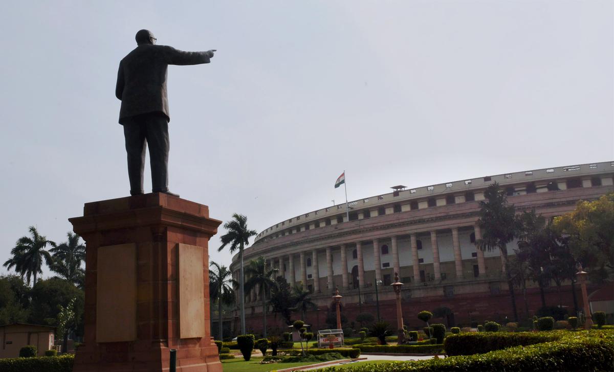 A view of the Parliament House in New Delhi and a statue of BR Ambedkar, one of the chief architects of the Constitution.