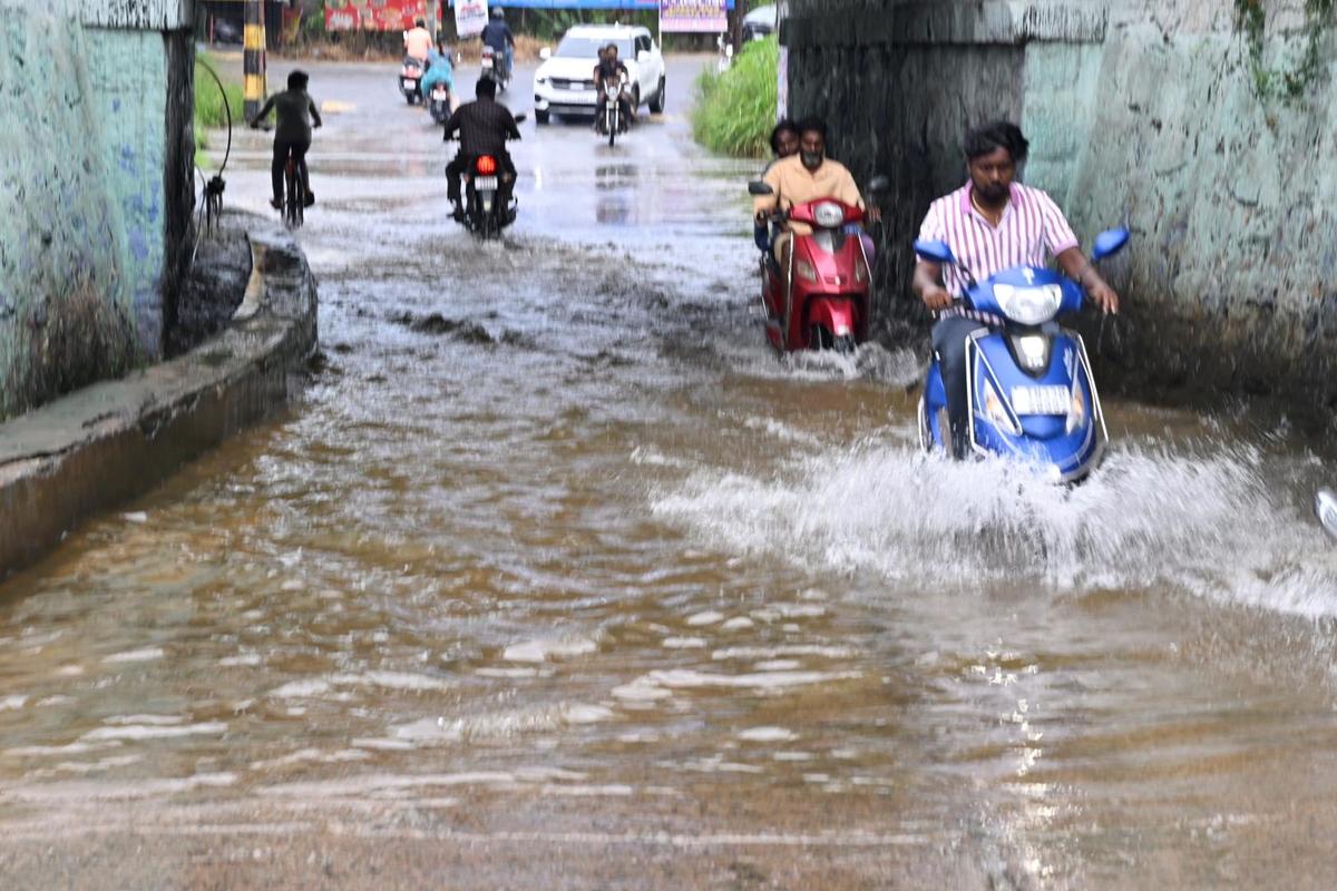 Waterlogging at the railway underpass in K.K. Nagar on Chennimalai Road in Erode on October 21, 2025 following downpour