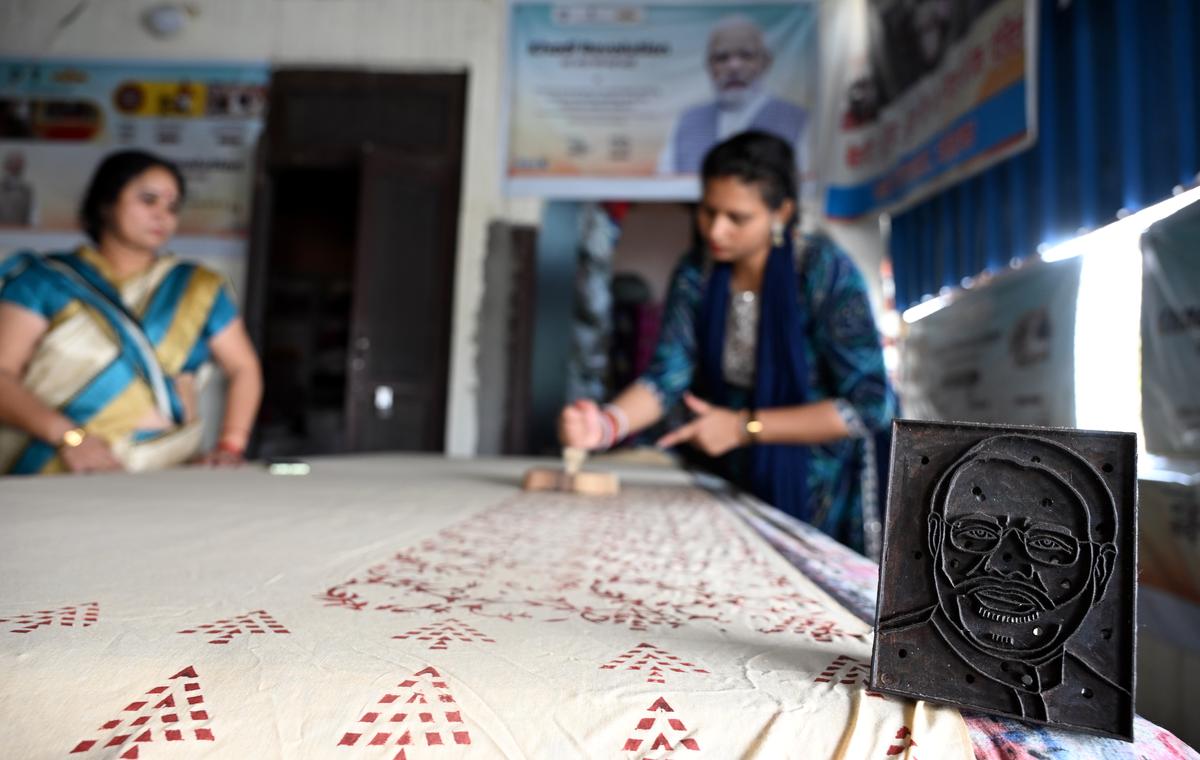 Member of Self Help Group in Haryana’s Rohtak engaged in hand block painting on a bed sheet, in Rohtak on Sunday.
