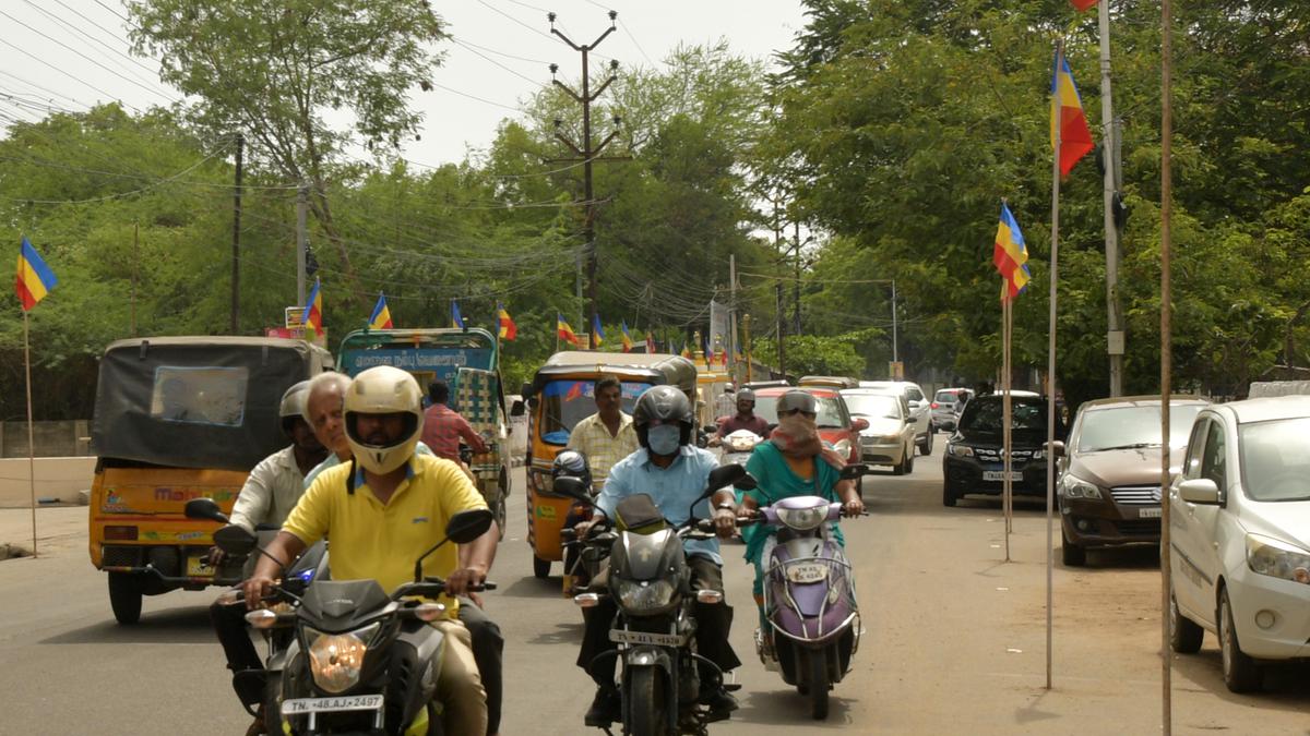 Practice of drilling holes on roads to erect party flags irks road users