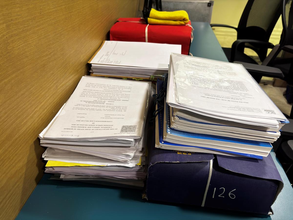 Files of cases stacked up at The Square Circle Clinic at NALSAR University of Law, Hyderabad. 