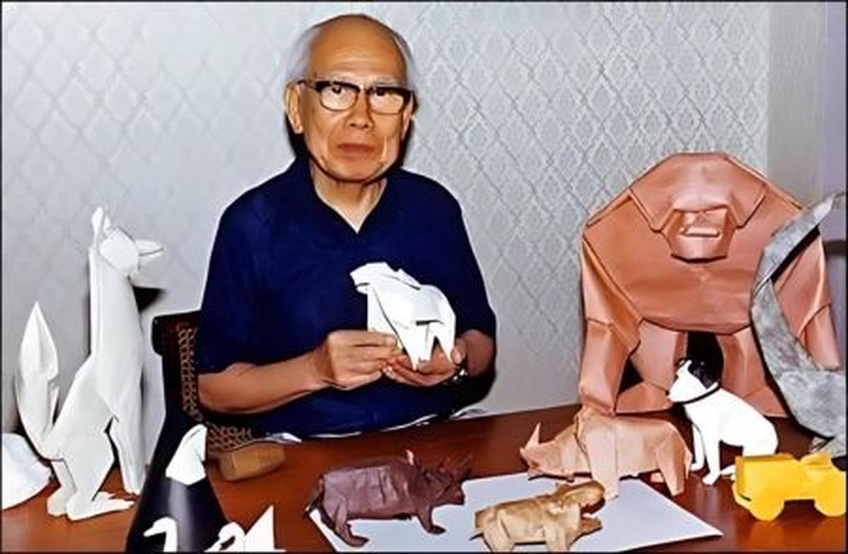 Akira Yoshizawa with his origami artworks