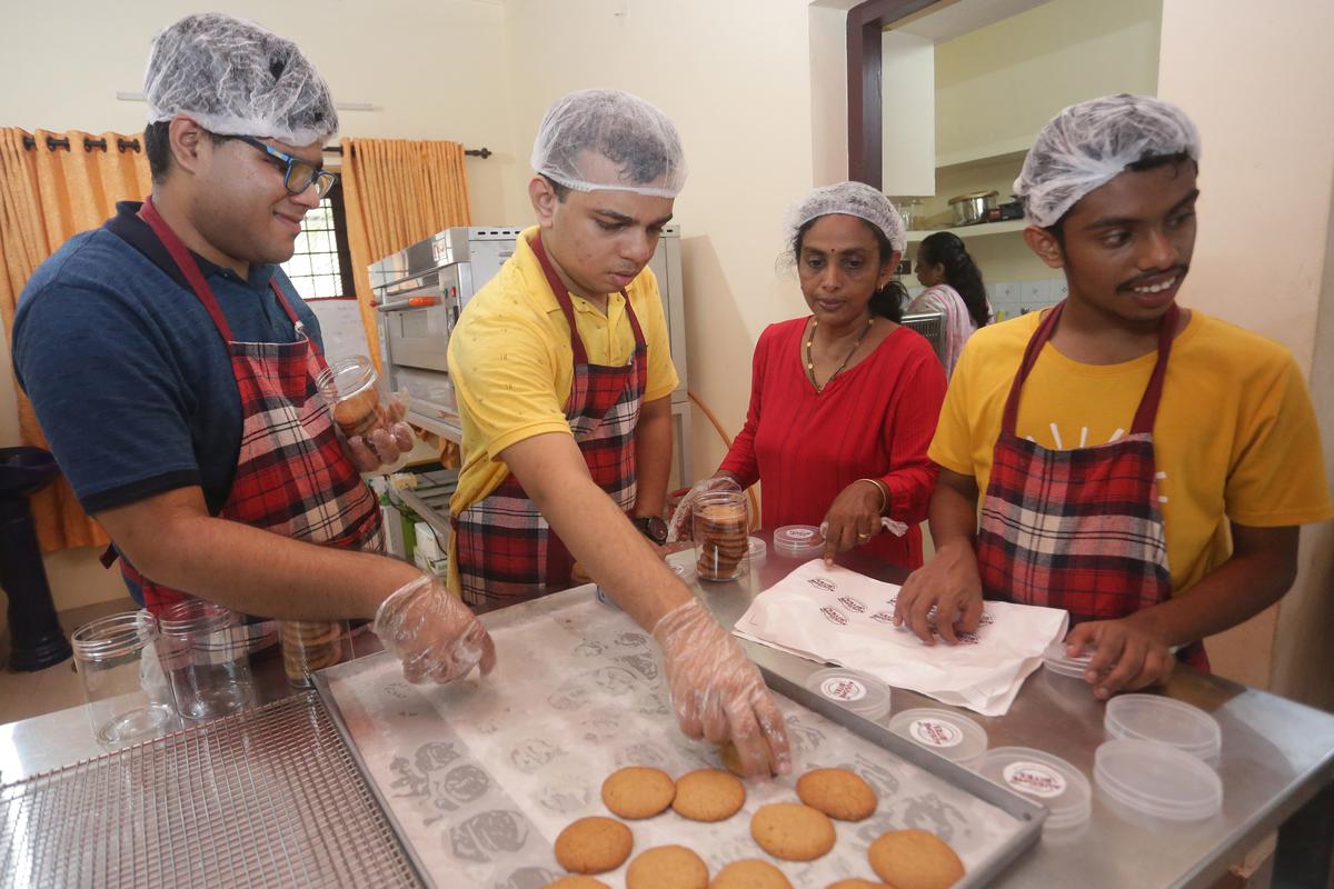 Deepthi Mathew helping the bakers of Ausome Bites  