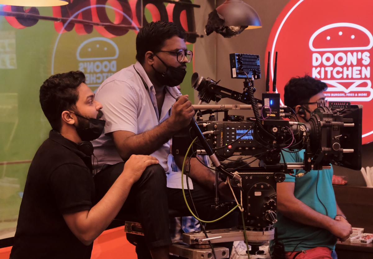 Director Mathukutty Xavier on the location of Mili with  cinematographer Sunil Karthikeyan