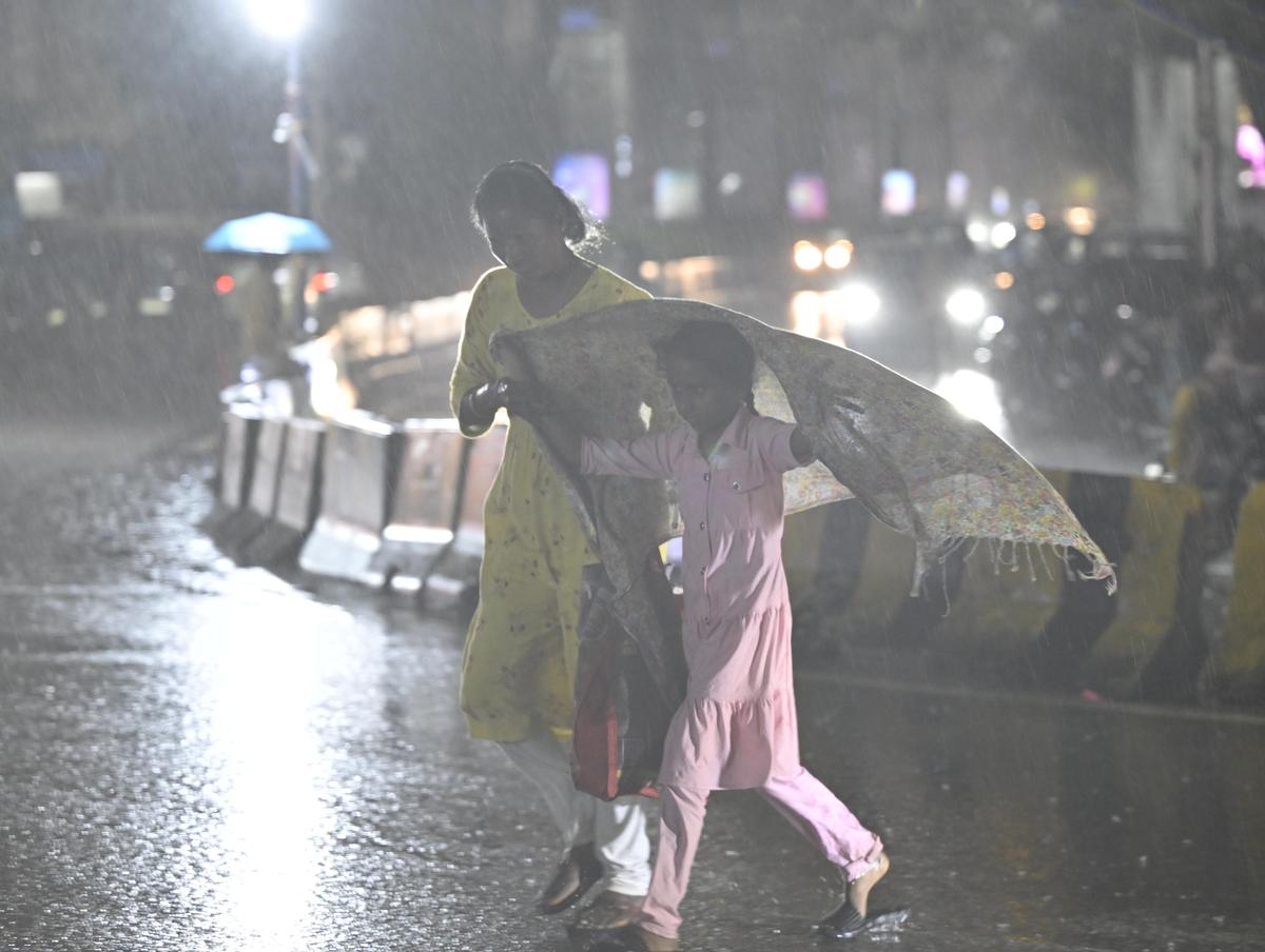 Commuters caught unawares in the sudden downpour in Secunderabad on Sunday.
