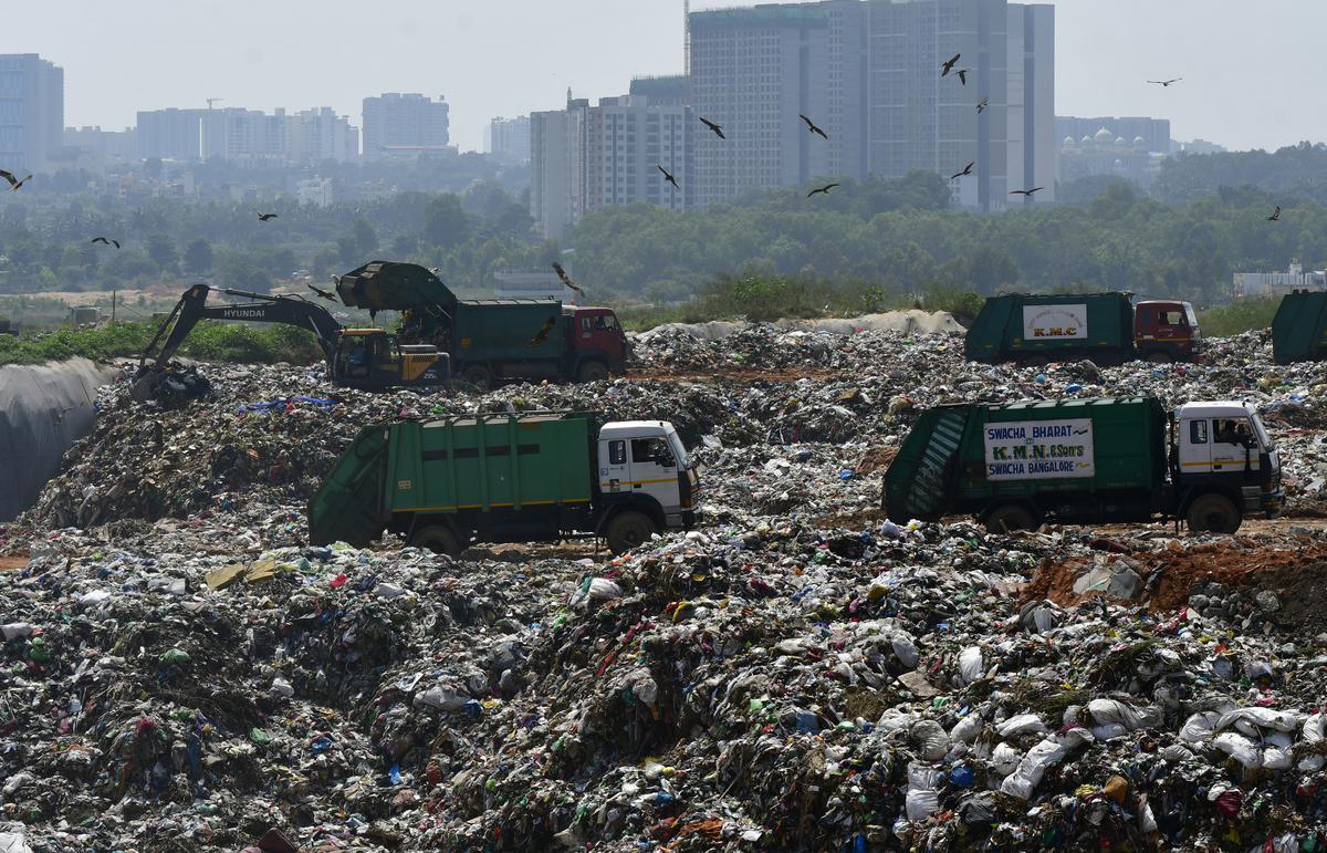 BBMP garbage trucks on the way to the landfill in Mittaganahalli quarry pit, in north Bengaluru. file photo