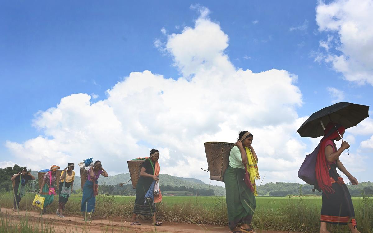 Tribal women return from weekly market in Karbi Anglong