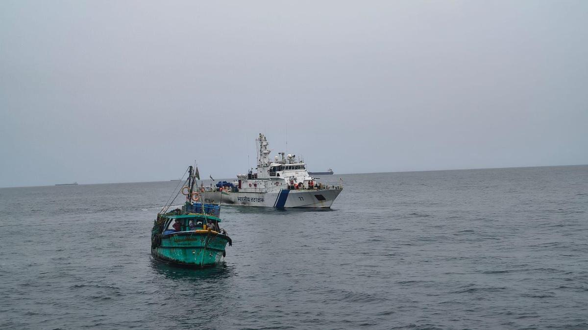 A Coast Guard vessal alerting a fishing boat to the impending cyclonic storm in the Bay of Bengal.  A Coast Guard vessal alerting a fishing boat to the impending cyclonic storm in the Bay of Bengal.