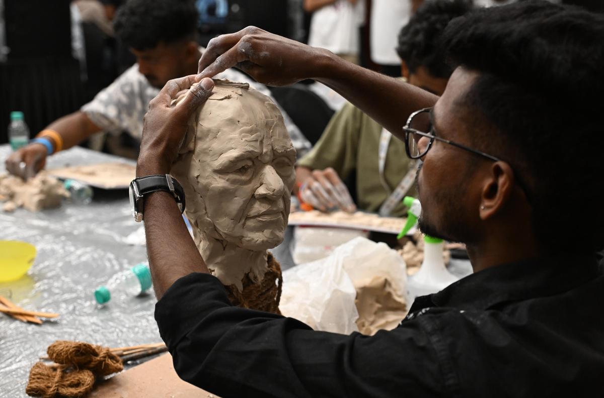 Participants make a clay portrait of renowned sculptor Ram V. Sutar during GAFX 2026 held at Lalit Ashok in Bengaluru on February 27, 2026.