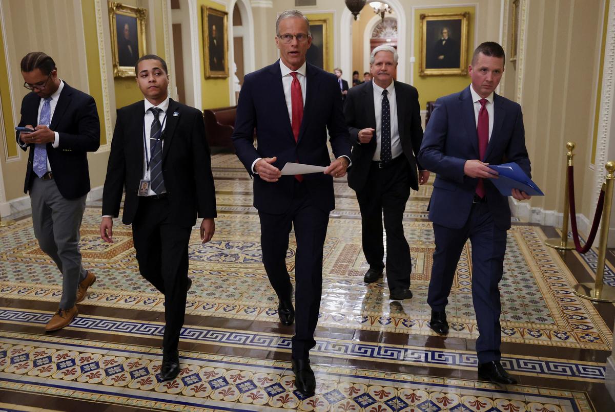 U.S. Senate Majority Leader John Thune (R-SD) and U.S. Senator John Hoeven (R-ND) leave after a press conference following a Senate vote, hours before a partial government shutdown is set to take effect on Capitol Hill in Washington, D.C., U.S., September 30, 2025. 