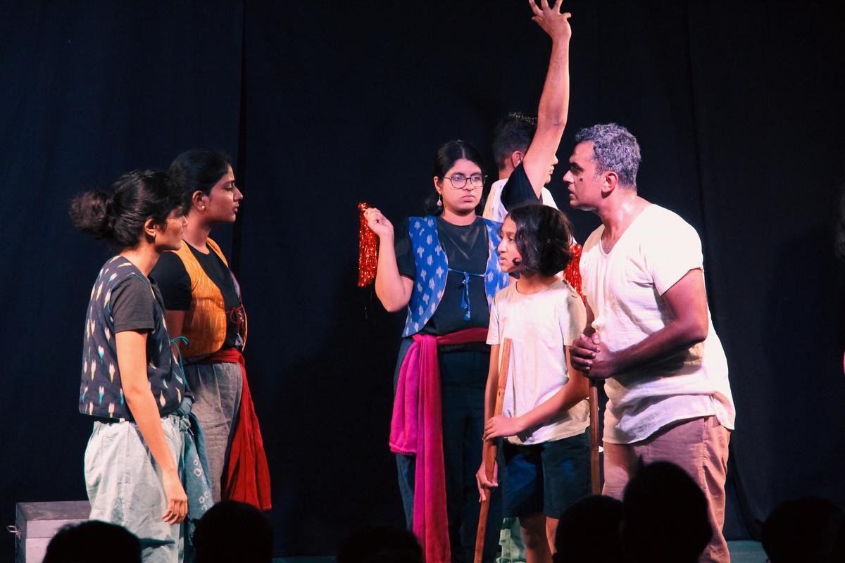 A still from the play Hattamalar Oparey (Beyond Hattamala) by Bangalore Little Theatre