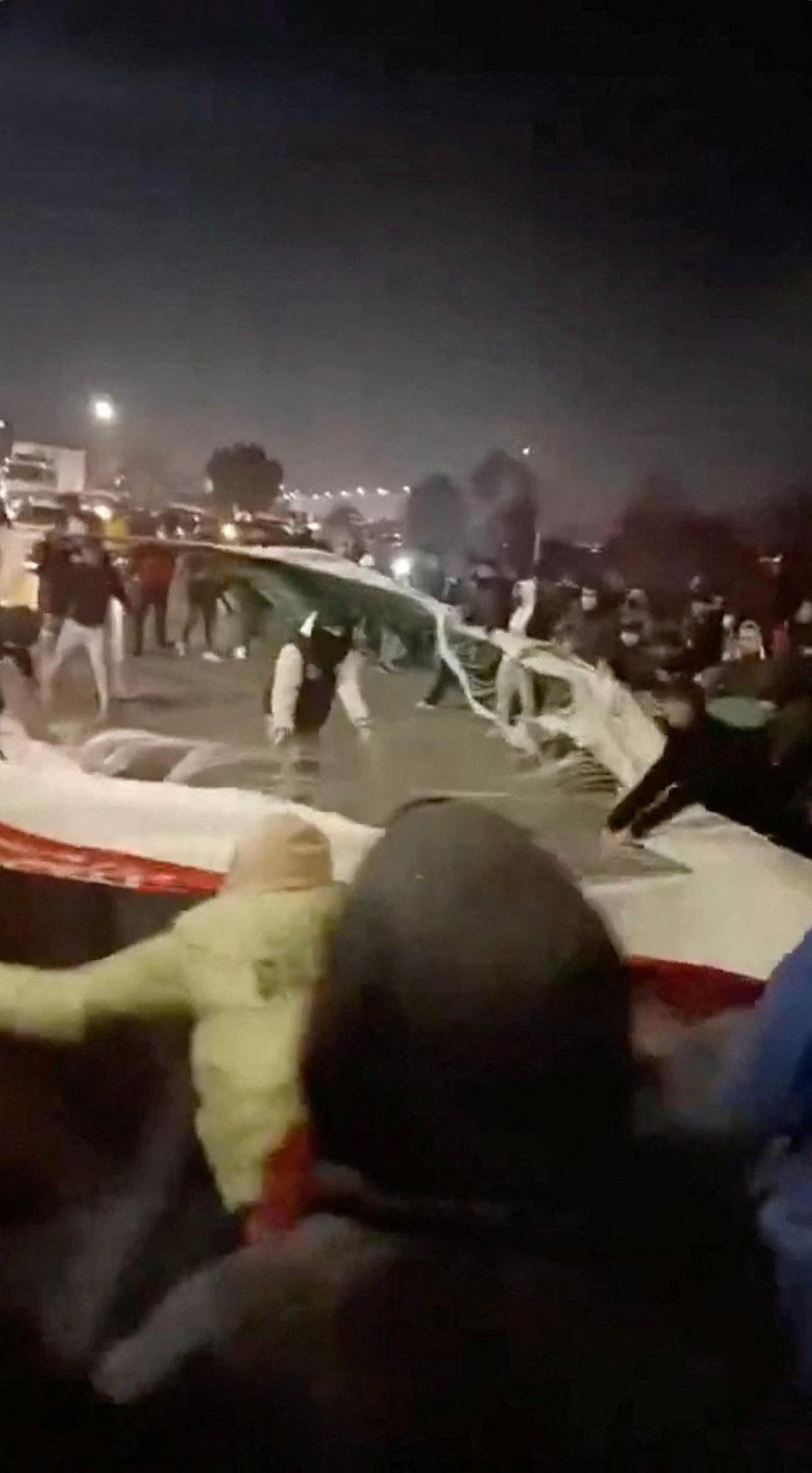 Watch: Iranians tear national flag amid protests over economic crisis