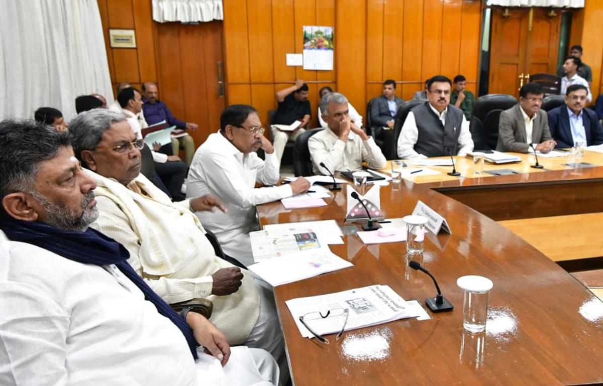 Chief Minister Siddaramaiah, Deputy Chief Minister D.K. Shivakumar,  Minister of Revenue Krishna Byre Gowda and officials having a meeting on Micro Finance in Bengaluru.