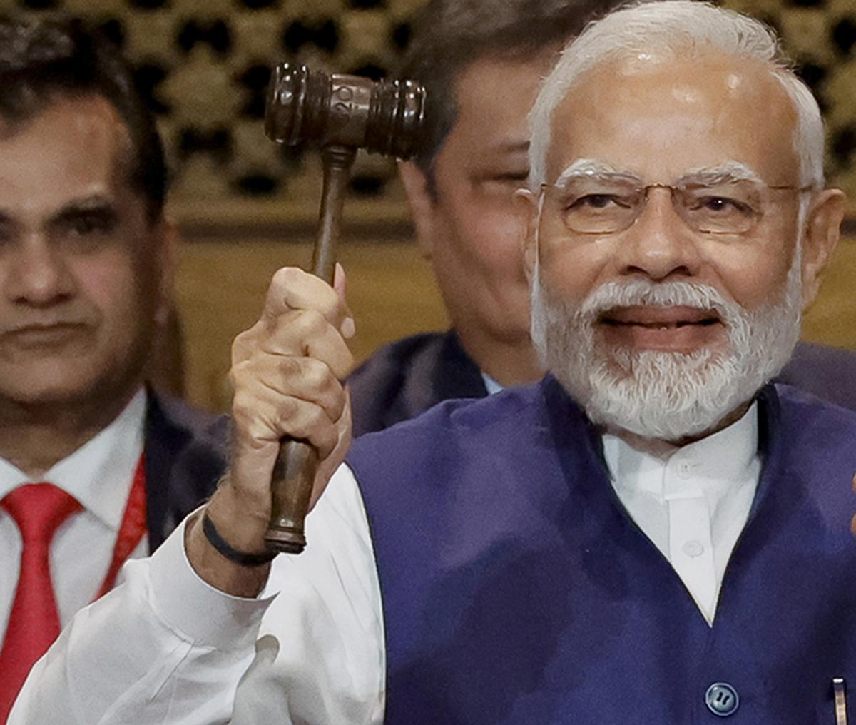 Prime Minister Narendra Modi holds the gavel during a G20 Presidency handover ceremony at the G20 Summit in Nusa Dua, Bali, Indonesia on November 16, 2022. 