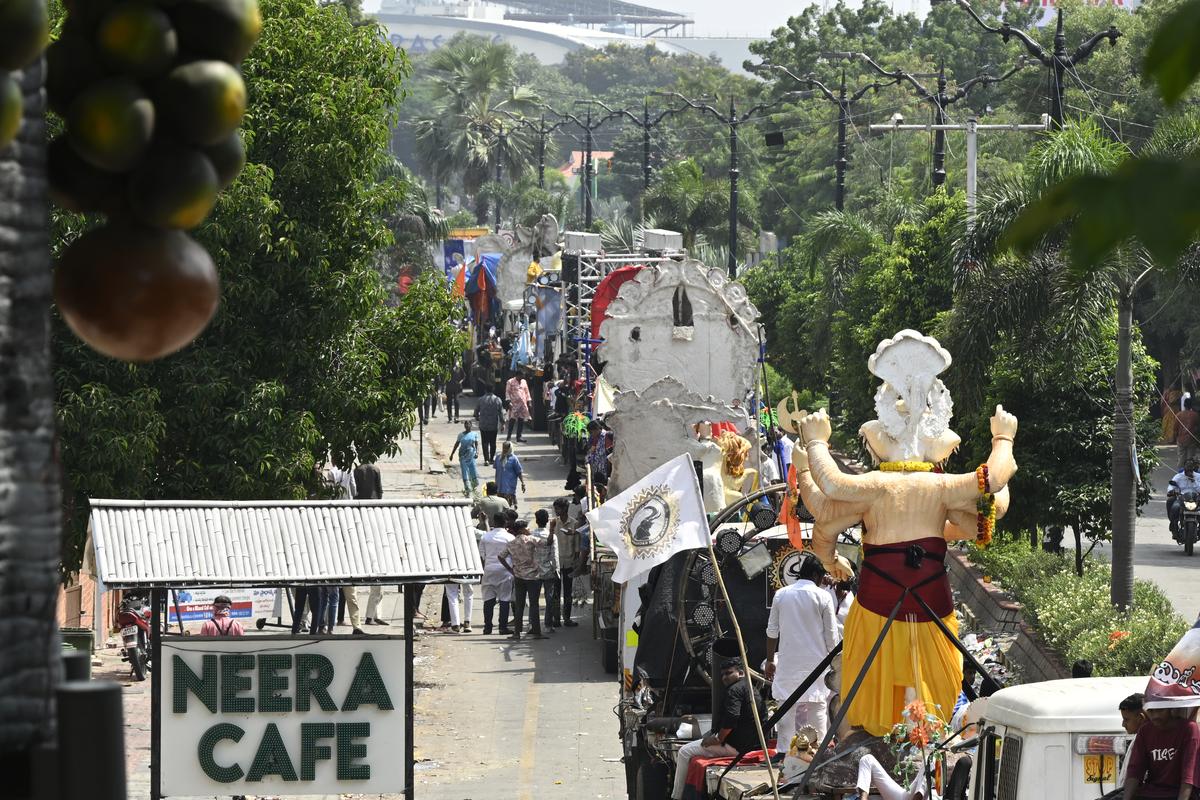 Long haul trucks carrying Ganesh idols wait in serpentine queue on Necklace road for immersion of the idols in Hussain Sagar, Hyderabad on Monday (September 16, 2024).