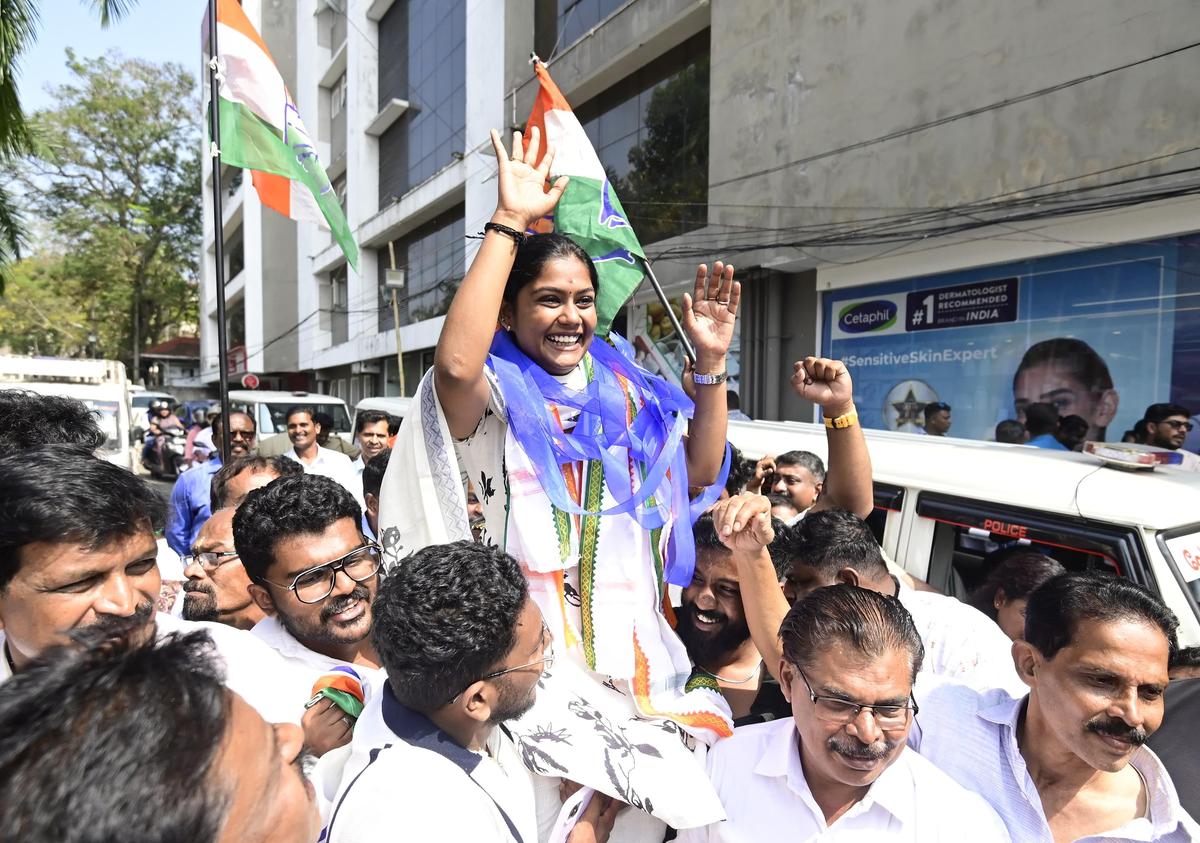 Vyshna Suresh, UDF candidate from Muttada, celebrates outside the counting centre following her victory to the city Corporation election in Thiruvananthapuram on Saturday.