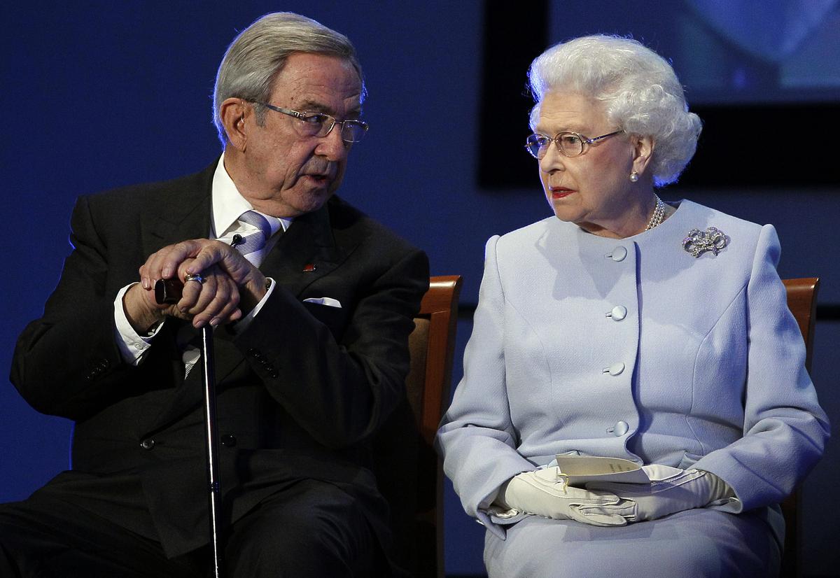 Britain’s Queen Elizabeth II, right, speaks with former King Constantine II during the opening ceremony of the Round Square International Conference at Wellington College in 2011. File.