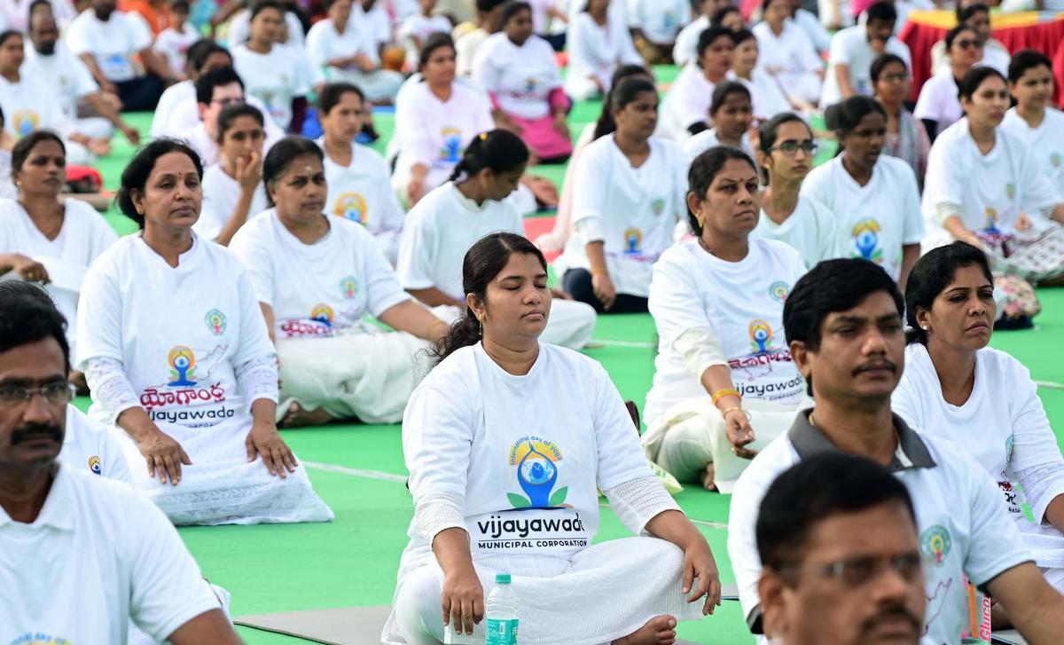 People taking part in the International Yoga Day celebrations at the Indira Gandhi Municipal Stadium in Vijayawada on  Saturday. 